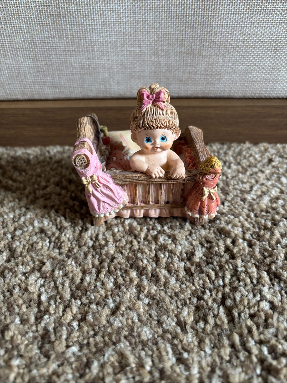 Vintage Ceramic World Baby Figurine in Pink Crib